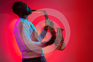 African American jazz musician playing the saxophone.