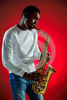 African American jazz musician playing the saxophone.