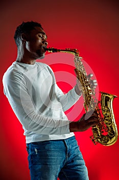 African American jazz musician playing the saxophone.