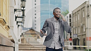 African american joyful businessman happy after talking phone about his new career