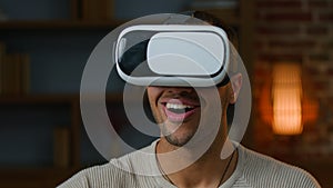 African american latino man gamer in VR goggles play game use virtual reality augmented glasses watching real simulation
