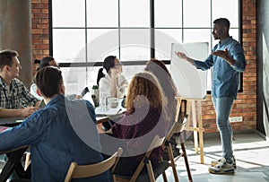 African-american leader lecturing his employees in office