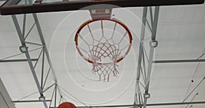 African american male basketball player scoring goal during match