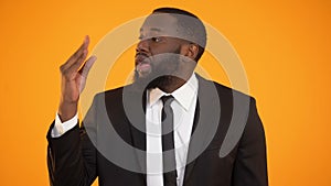 African-american male showing blah-blah sign, fake news, unreliable information