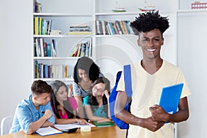 African american male student with group of international students