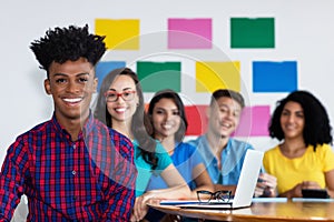 African american male student with group of international students