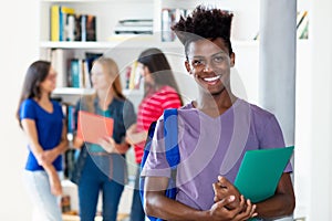 African american male student with group of multi ethnic college students photo