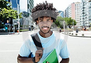 African american male student with typical hairstyle in city