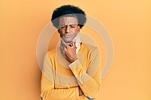 African american man with afro hair wearing cervical neck collar thinking looking tired and bored with depression problems with