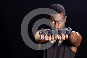 African American man in a boxing stance, with copy space