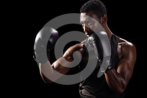 African American man in a boxing stance, with copy space