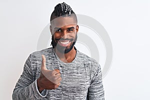 African american man with braids wearing grey sweater over isolated white background doing happy thumbs up gesture with hand