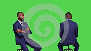 African american man with business suit sitting on chair