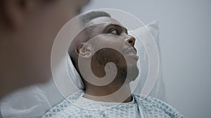 African American man consults with doctor before surgery