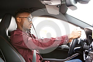 African american man driving car