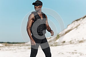 African American man, fitness athlete, in sportswear, with muscular body, outdoors