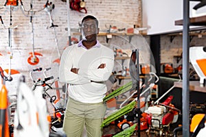 African-american man in gardening tools store