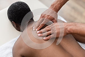 african american man getting back massage