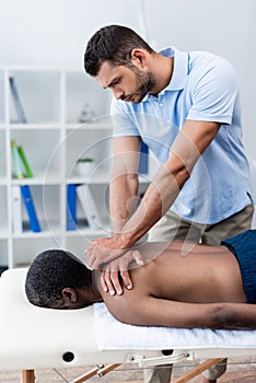african american man getting back massage