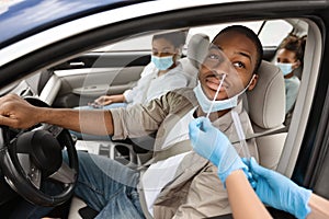 African American Man Getting Tested For Coronavirus In Car