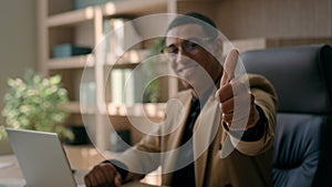 African American man happy glad businessman smiling entrepreneur office manager working laptop looking at camera smile