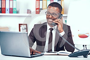 African American Man Has Business Call in Office.