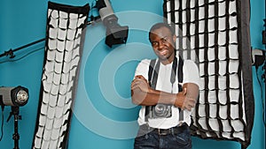 African american man having backstage photography equipment