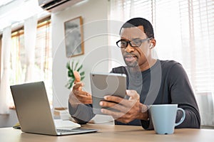 African American man having video call on digital tablet