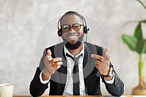 African American man in headset talking to camera