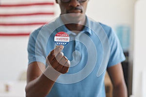 African-American Man Holding I VOTED Sticker