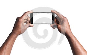 African-American man holding mobile phone