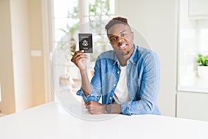 African american man holding passport of United States of America with a confident expression on smart face thinking serious