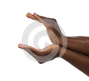 African-American man holding something in hands on white background