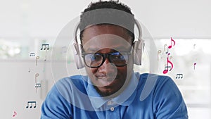 African -American man listen to music in headphones with musical notes hologram