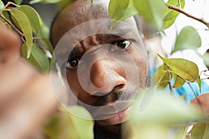 African-american man looking for job in unusual places at his home