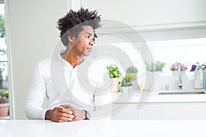 African American man looking to side, relax profile pose with natural face with confident smile