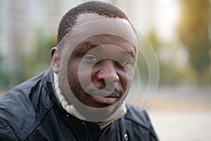 African american man from Nigeria looks at camera