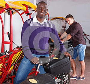 African-American man offering cycle rickshaw service