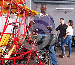 African-American man offering cycle rickshaw service