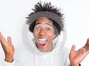 African American man over white isolated background very happy and excited, winner expression celebrating victory screaming with
