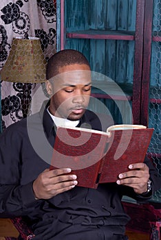 African American Man Reading a Book