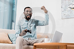 african american man rejoicing while