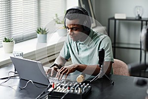 African American Man Setting Up Recording Equipment