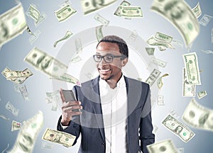 African American man, smartphone, dollar rain