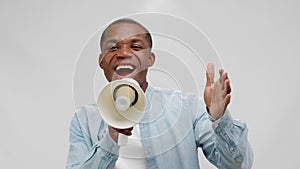 African american man is smiling shouting in loudspeaker on sale, black friday.