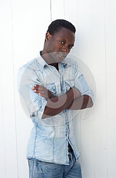 African american man standing outdoors with arms crossed