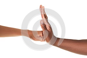 African American man stopping woman`s fist on white background, closeup. Antiracism concept photo