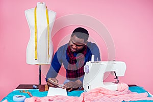 African American man tailor seamstress workshop stylish male model clothes designer the process of creating a new