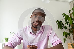 African-american man talking on web camera, video call, headshot