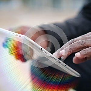 African american man uses tablet computer. Black man hands holds tablet pc